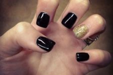19 black short nails with a glitter gold accent