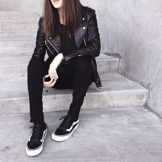 rock-style outfit with a black leather jacket and leggings