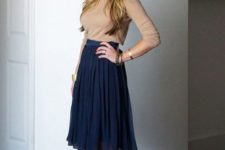 22 pleated midi navy skirt, a neutral top and nude heels