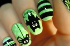 26 neon green nails with black accents, spiders and bats