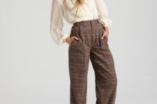 High-waisted trousers with creme blouse