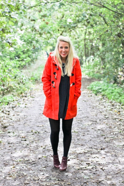 Red coat with black dress, black tights and purple boots