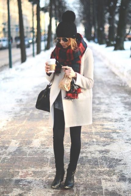 With black beanie, plaid oversized scarf, over the knee boots and skirt