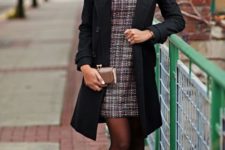 With black coat, metallic shoes and black tights