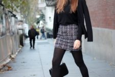 With black jacket, tights and pumps