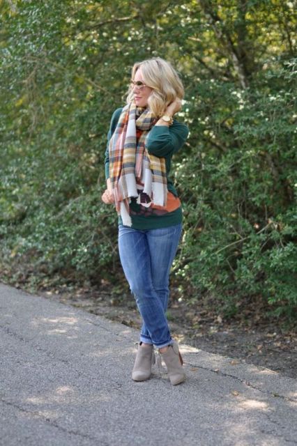 With cuffed jeans, plaid scarf and green shirt
