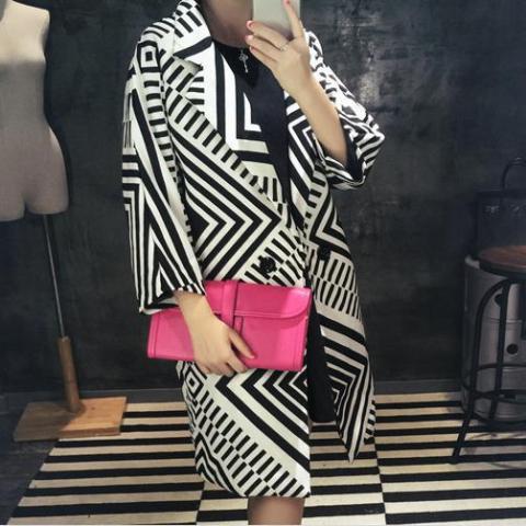 With eye-catching pink clutch