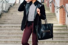 With gray crop shirt, leather jacket and bag