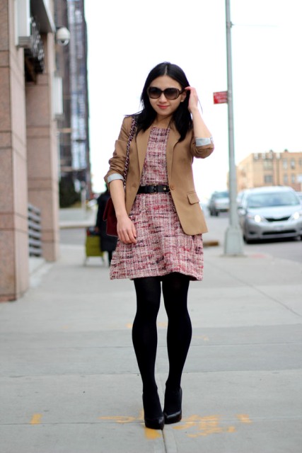 With light brown jacket, black tights and shoes