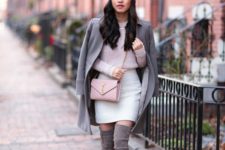 With light pink sweater, white skirt, coat and beanie