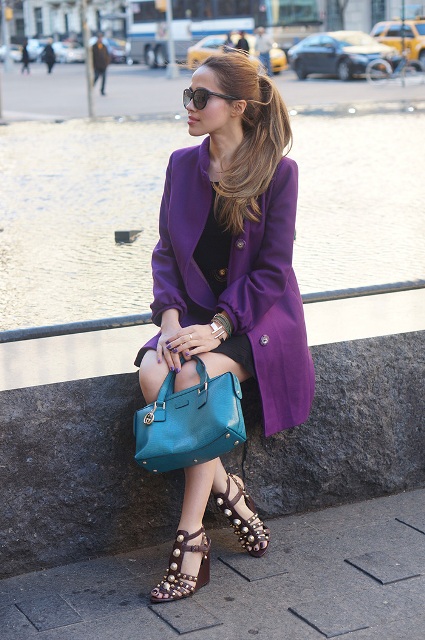 With little black dress, heels and small colored bag