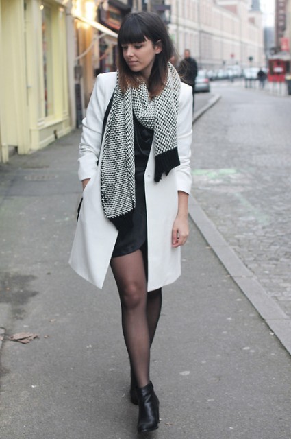 With mini dress, ankle boots and black and white scarf