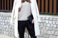 With oversized sweater, loose pants and white sneakers