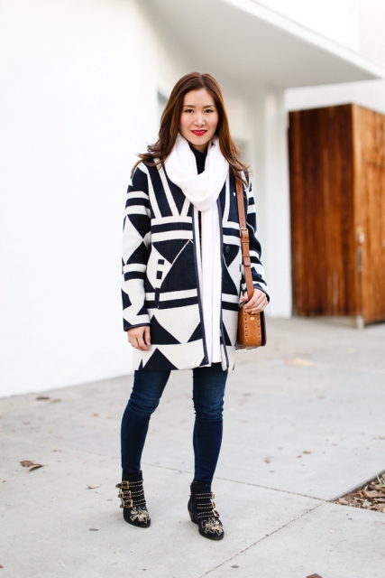 With skinny jeans, printed ankle boots, white oversized scarf and leather bag