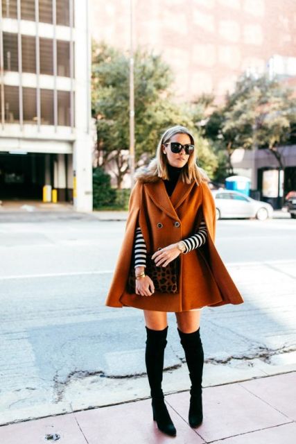 With striped shirt, over the knee boots and leopard clutch