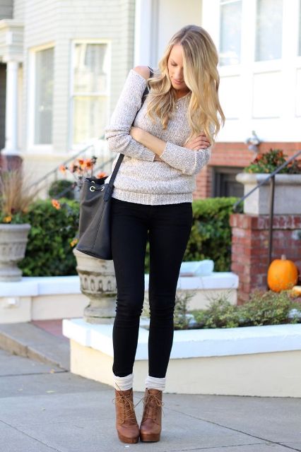 With sweater, black pants and socks