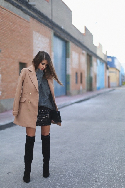 With sweatshirt, bright skirt and over the knee boots