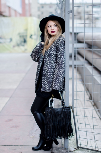 With wide brim hat, fringe bag and leather boots