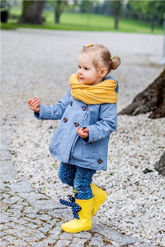 yellow boots, polka dot jeans, a denim coat and a yellow scarf