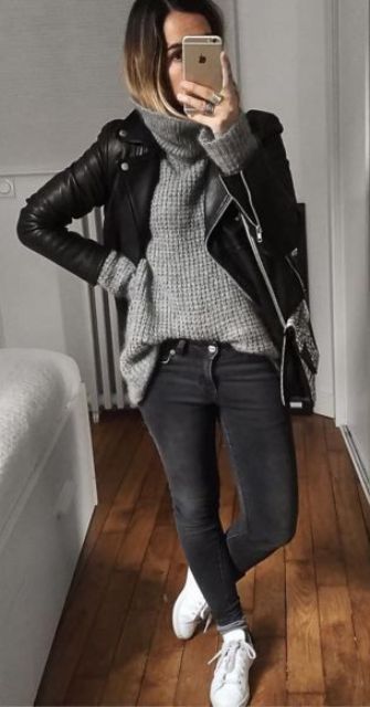 black jeans, a grey chunky knit sweater, white sneakers and a black leather jacket