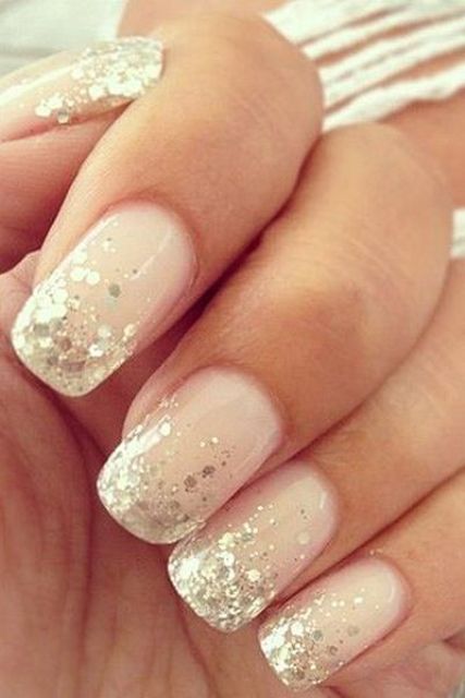 blush nails with gold sequins on the edge