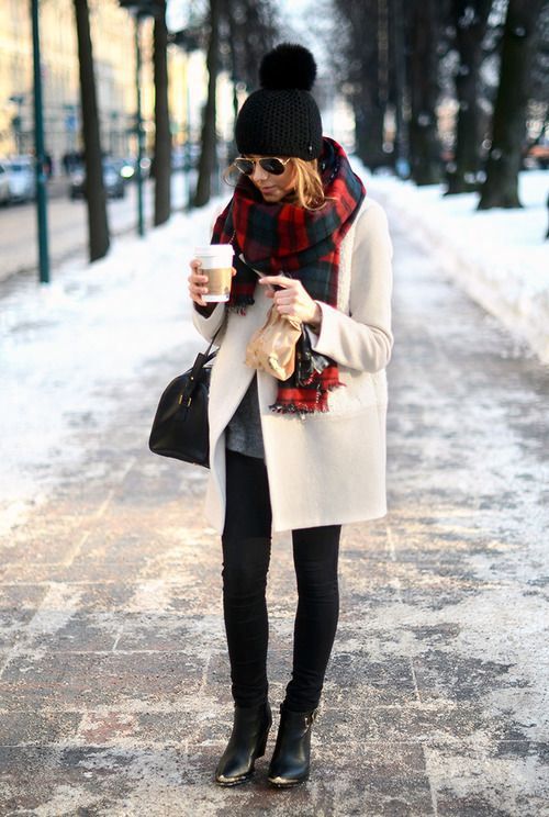 black leggings, heels, a white coat and a plaid scarf