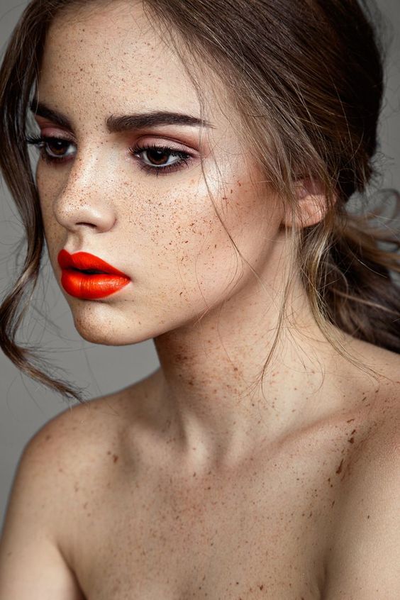 orange lips with an olive skin stone