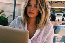 a long chestnut bob with blonde highlights, darker roots and messy waves looks beachy and relaxed, this is a perfect look for summer