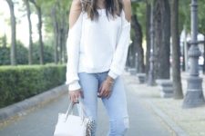13 ripped blue jeans, a white off the shoulder and heels