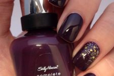 15 dark red nails with an accent one with gold sequins
