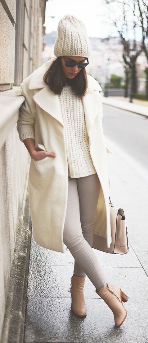 neutrals   grey jeans, a white chunky sweater, beanie and coat, tan heels