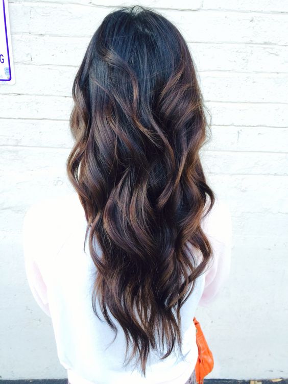 curly black hair with brown highlights