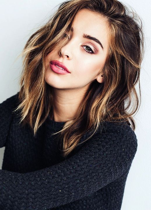 a dark brunette long bob with caramel and blonde highlights and messy waves is a stylish and catchy idea for a modern and bold look