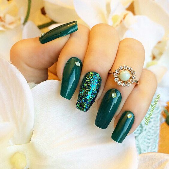 green nails and an accent green sequin nail looking as a mermaid tail