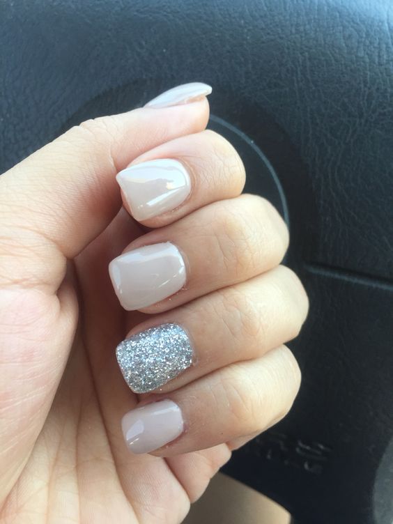 nude nails with a silver accent nail