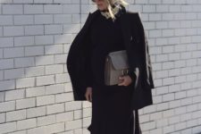 With black classic jacket, midi skirt and clutch