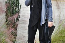 With black shirt, pants, hat and oversized scarf