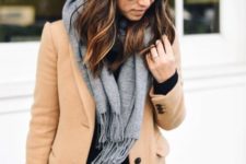 With camel coat and gray scarf