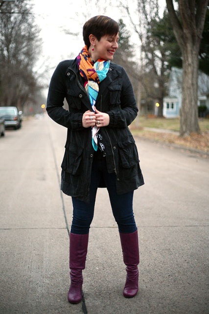 With colorful scarf, black coat and jeans