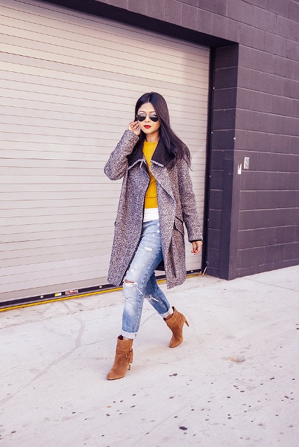 With distressed jeans, yellow and white shirt and midi coat