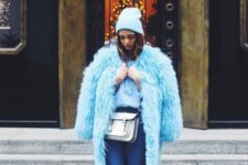 With faux fur knee-length coat, crop jeans and heels