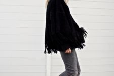 With fringe jacket and distressed jeans