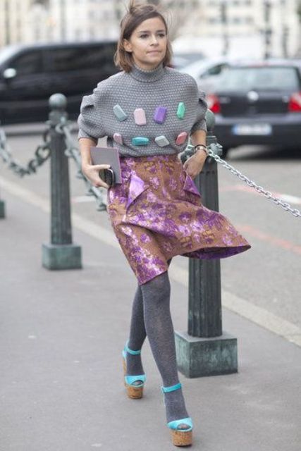 With funny and unique sweater, gray tights and platform shoes