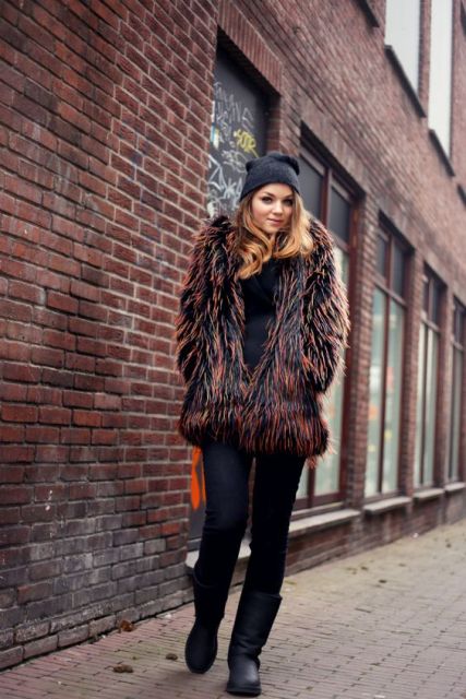 With fur short coat, flat boots and jeans