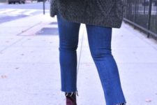 With gray oversized sweater, crop jeans and purple bag