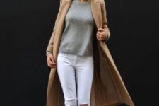 With gray sweatshirt, white jeans and camel midi coat