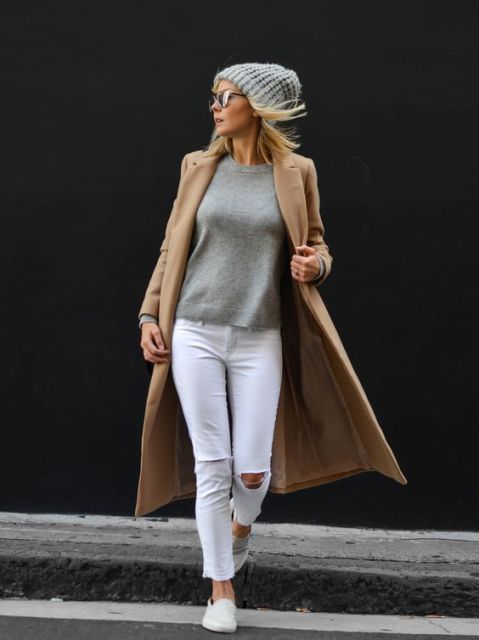 With gray sweatshirt, white jeans and camel midi coat
