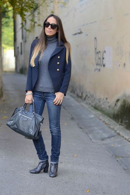 With gray turtleneck, navy blue jacket and skinny jeans