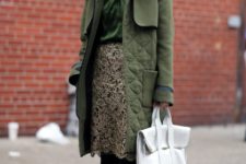 With green blouse, flats, white bag and green coat