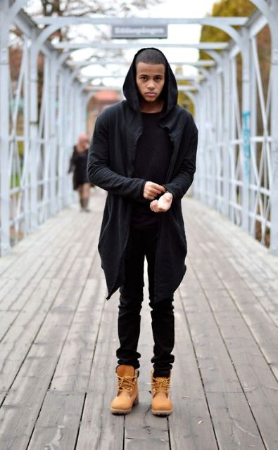 With hooded coat, black shirt and pants